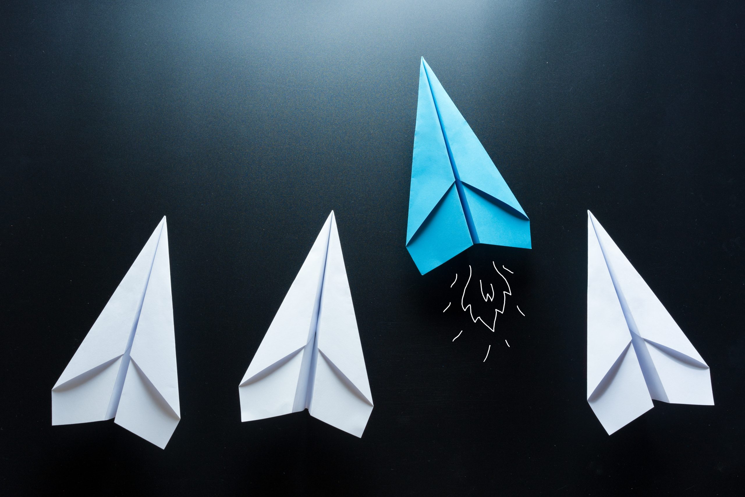 Four paper airplanes representing market-driven yields.